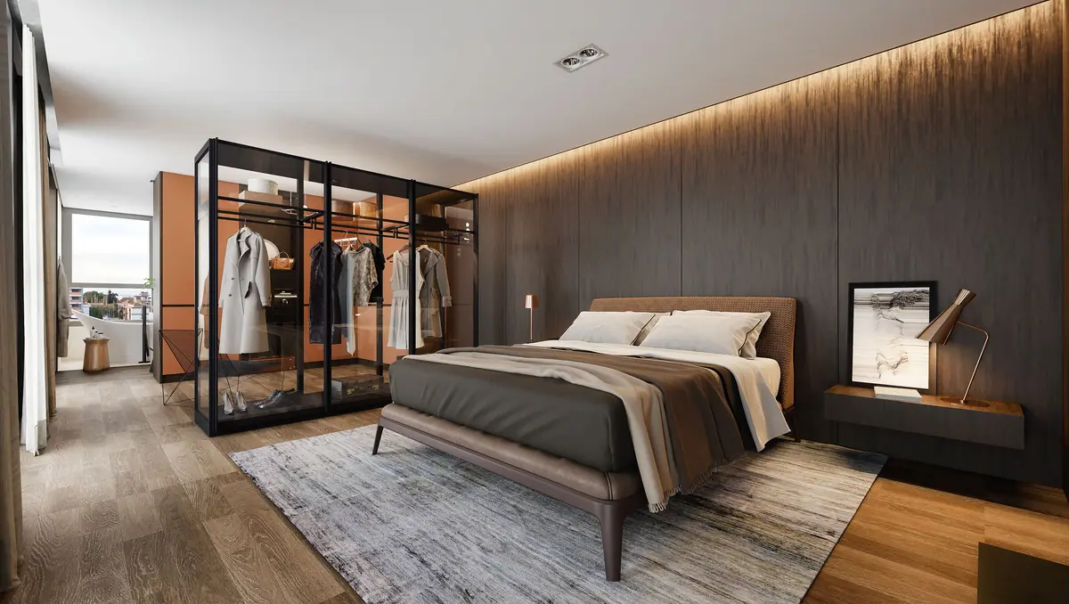 Suite with glass walk-in closet and wood paneling
