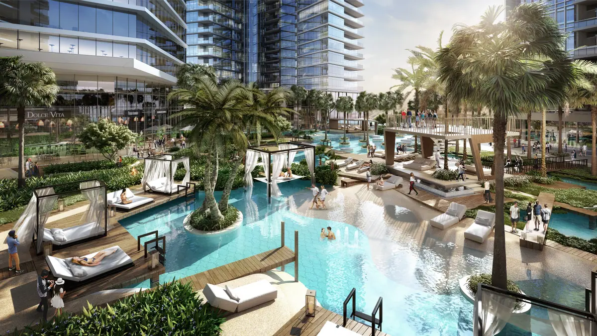 Leisure area with winding pool, cabanas and palm trees