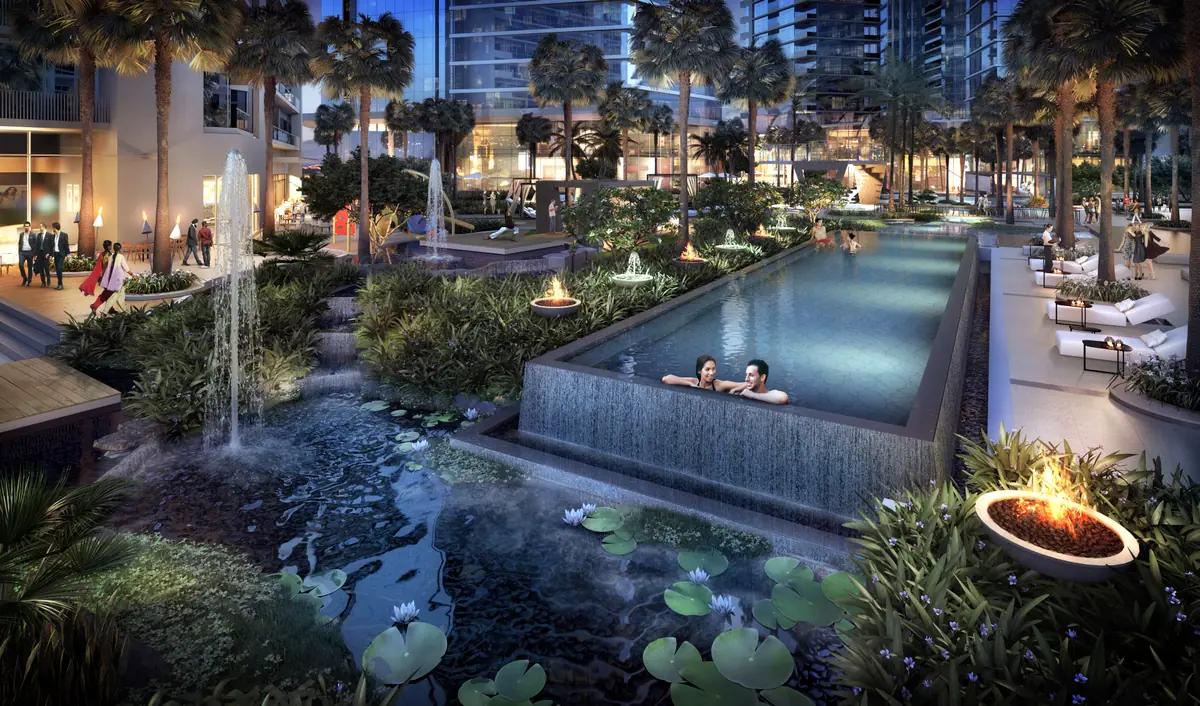 Night landscaping with raised pool, fire pit and water features